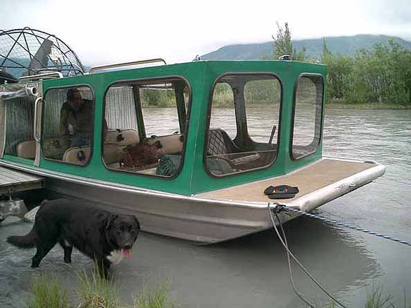 Green Airboat with Dog and Hat