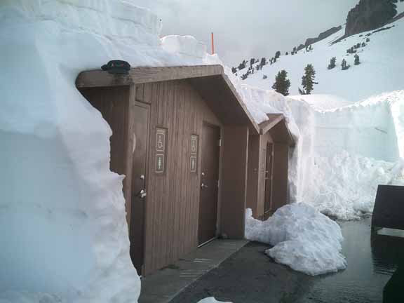 snow covered outhouse