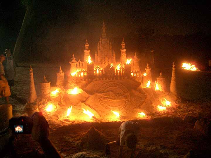 sand castle burns on fire